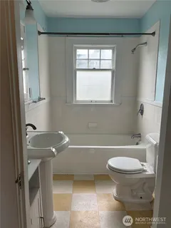 a bathroom with a toilet and a sink