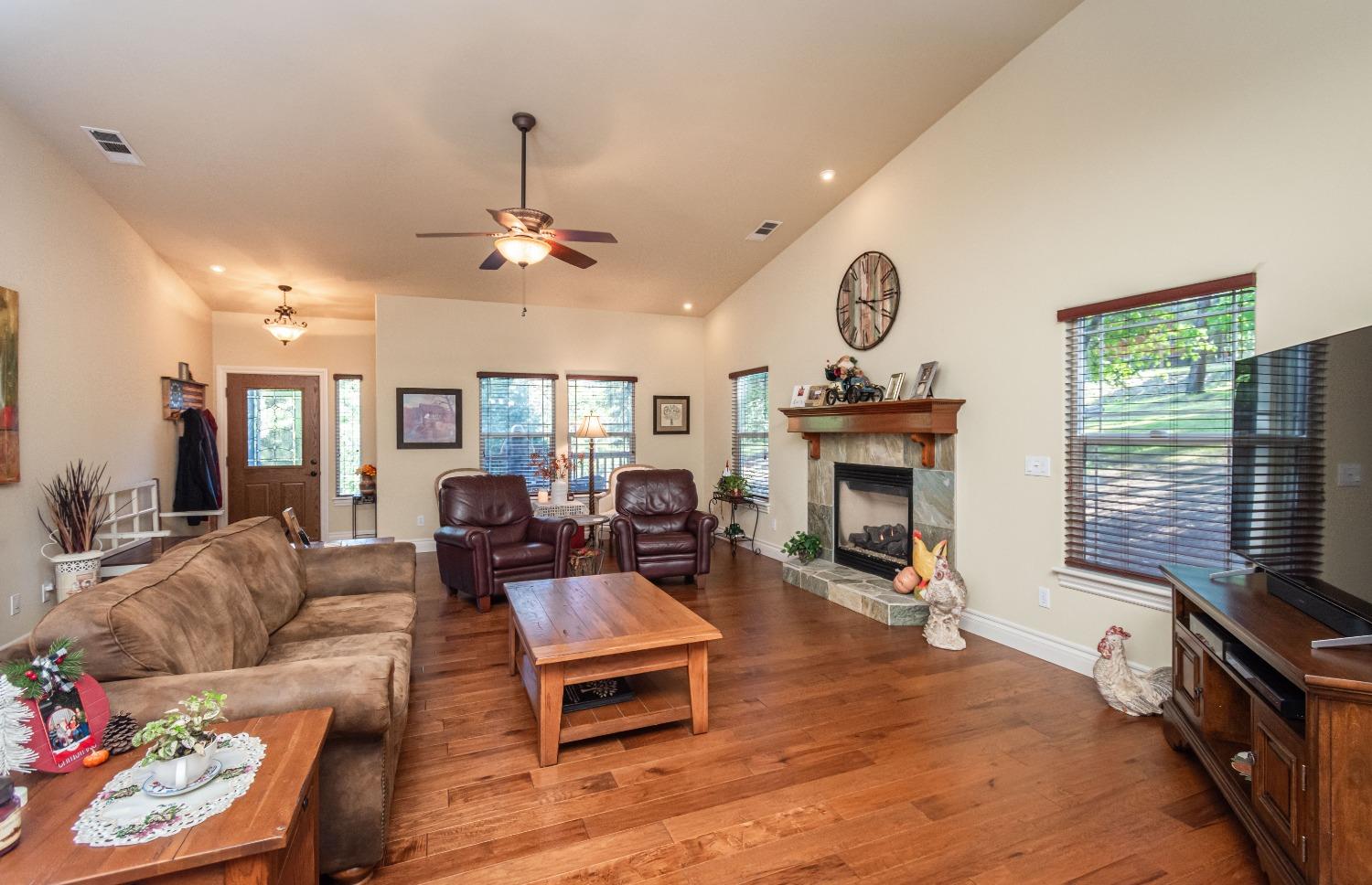 6570 Mosquito Road Placerville, CA 95667 - Photo 15 of 56 a living room with furniture a window and a fireplace
