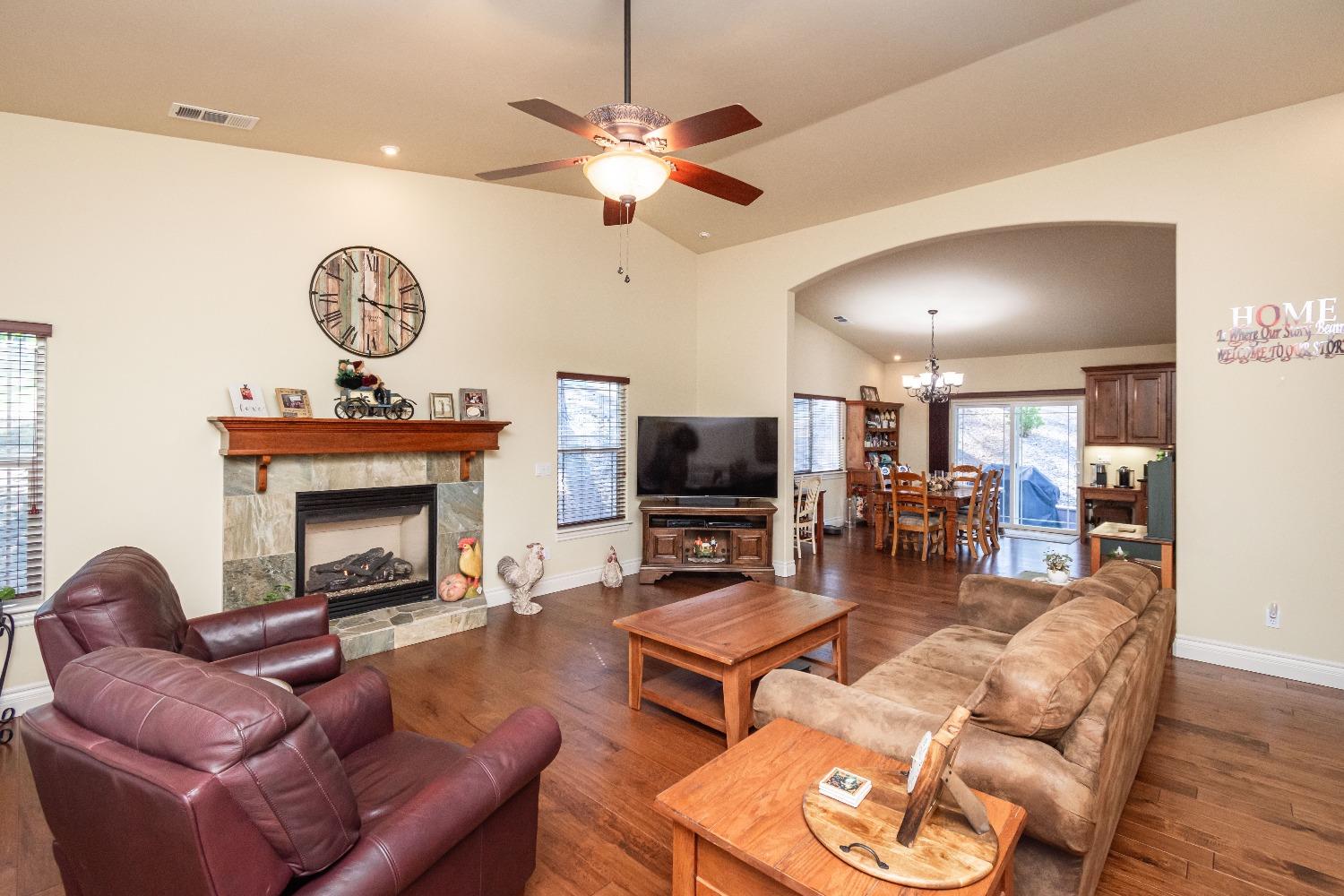 6570 Mosquito Road Placerville, CA 95667 - Photo 17 of 56 a living room with furniture a fireplace and a flat screen tv