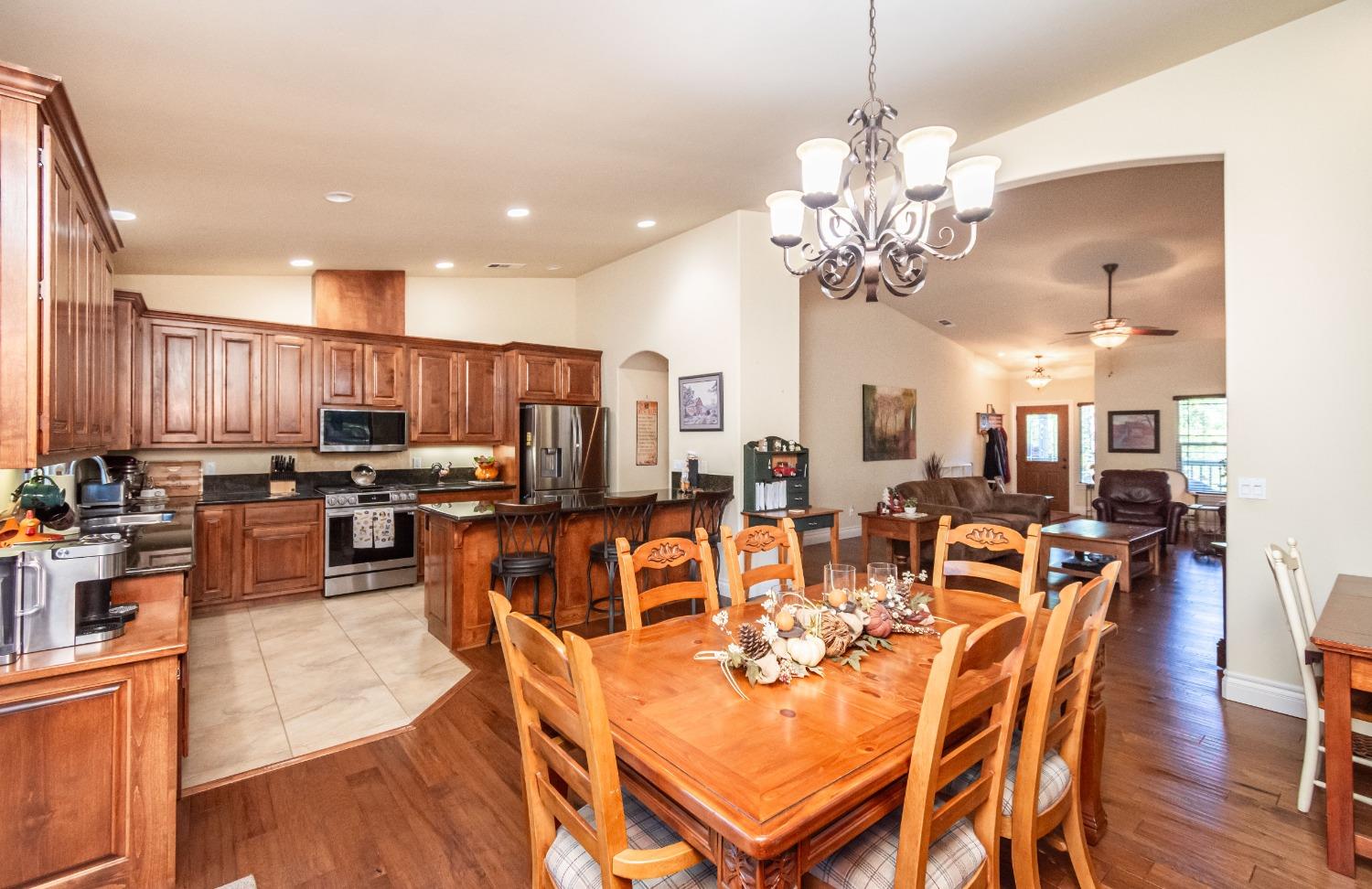 6570 Mosquito Road Placerville, CA 95667 - Photo 20 of 56 a very nice looking dining room with kitchen island furniture and a chandelier