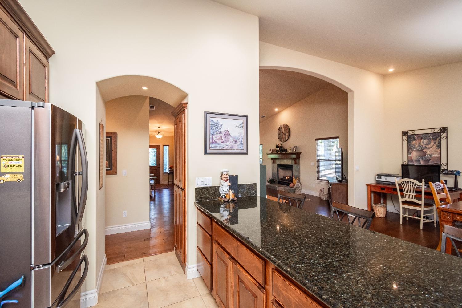 6570 Mosquito Road Placerville, CA 95667 - Photo 26 of 56 a kitchen with stainless steel appliances granite countertop a refrigerator and a sink