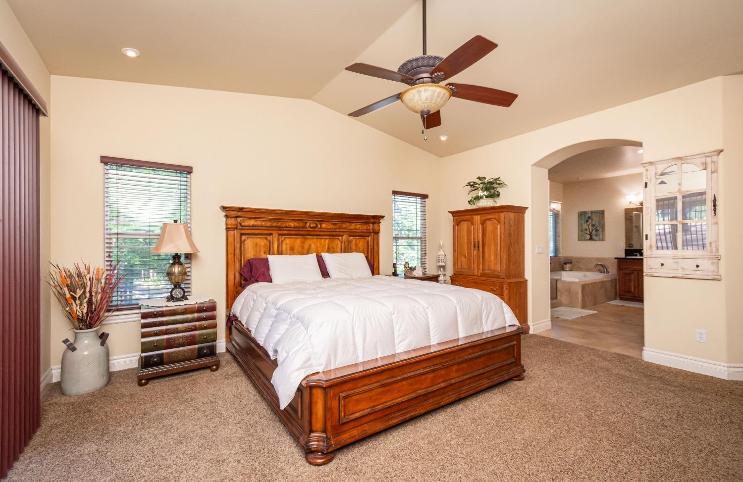 6570 Mosquito Road Placerville, CA 95667 - Photo 29 of 56 a bed room with a bed and a ceiling fan