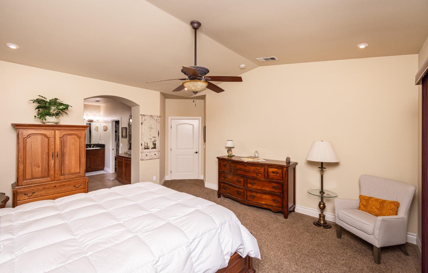 6570 Mosquito Road Placerville, CA 95667 - Photo 30 of 56 a bedroom with a bed and a chandelier