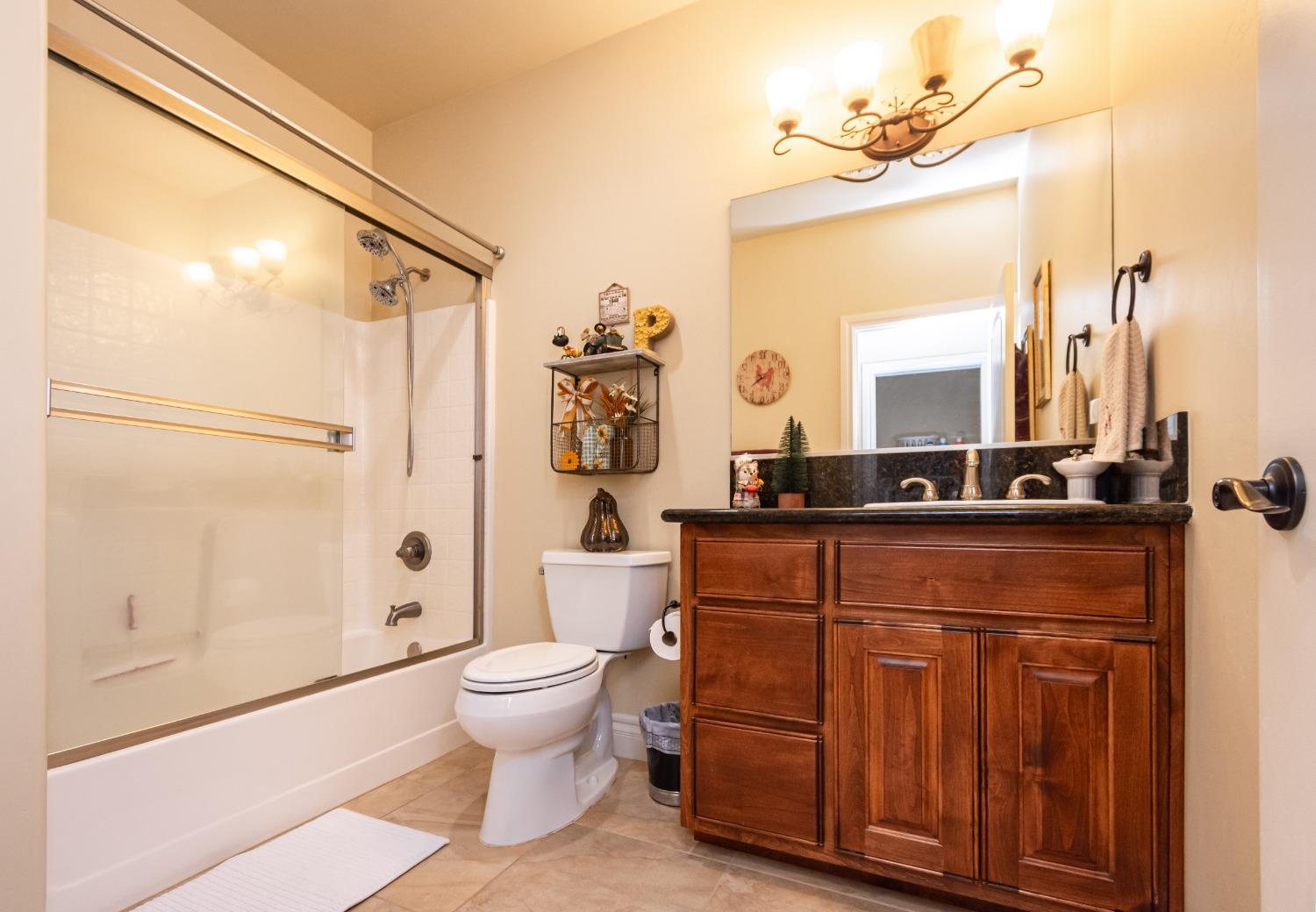 6570 Mosquito Road Placerville, CA 95667 - Photo 36 of 56 a bathroom with a sink a toilet and shower