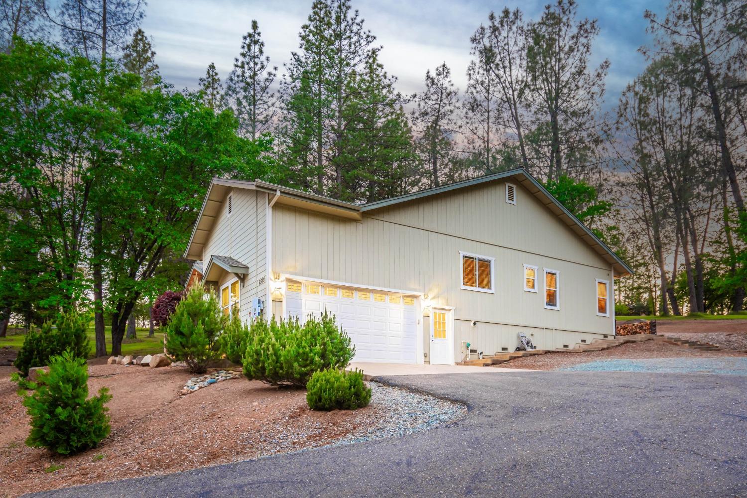 6570 Mosquito Road Placerville, CA 95667 - Photo 9 of 56 a view of a house with a yard and garage