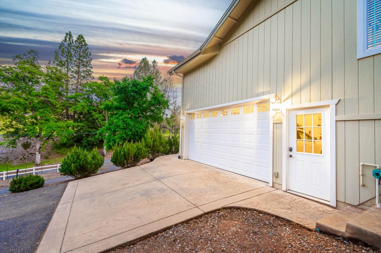 6570 Mosquito Road Placerville, CA 95667 - Photo 10 of 56 a backyard of a house with plants and trees