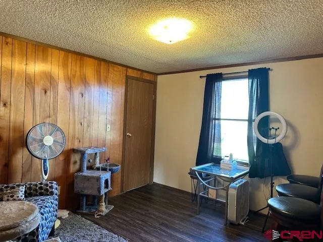 a living room with couch chairs and a window