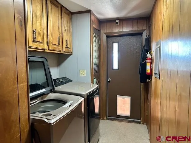 a view of a chair and tables in the garden