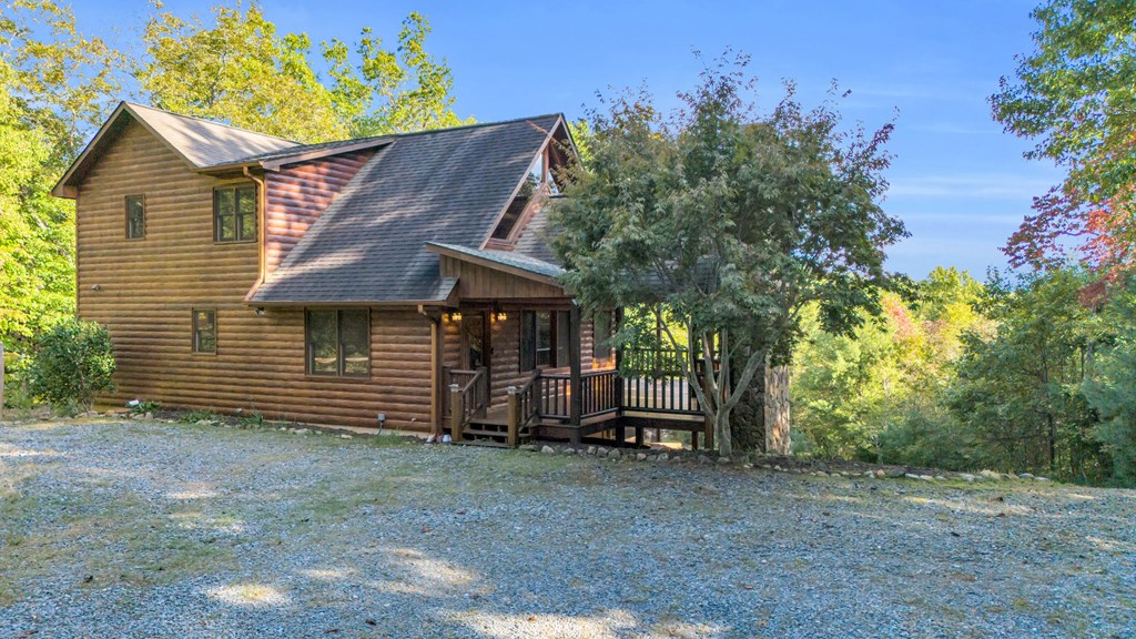 691 Mitchell Branch Road Morganton, GA 30560 - Photo 2 of 77 a view of a house with a yard and hanging chair