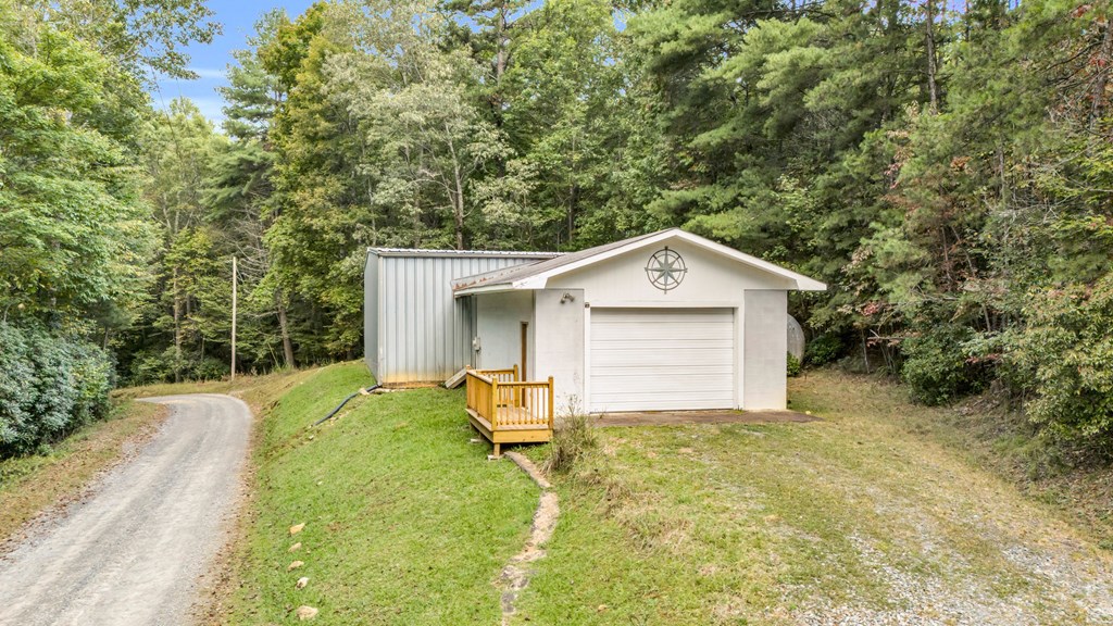 691 Mitchell Branch Road Morganton, GA 30560 - Photo 68 of 77 a front view of a house with yard and garage