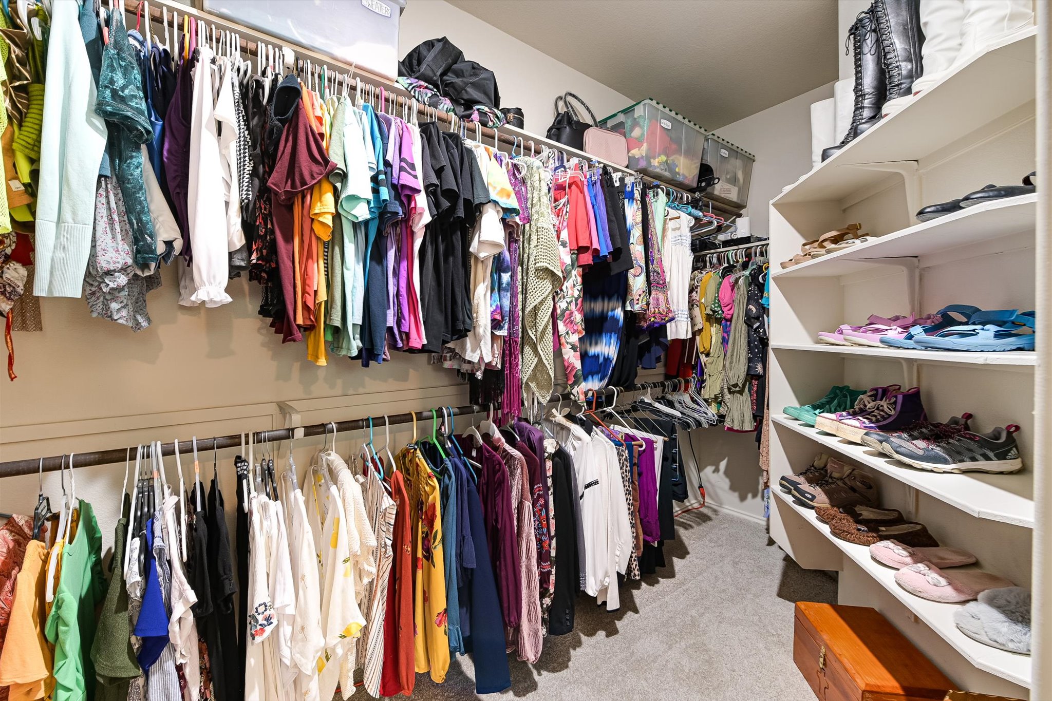 536 Dragon Ridge Road Buda, TX 78610 - Photo 13 of 20 Walk-in closet featuring multiple hanging rods for clothing storage
