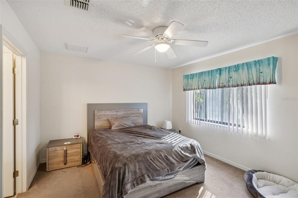 8340 Nevada Street Spring Hill, FL 34606 - Photo 11 of 23 a bedroom with a bed and window