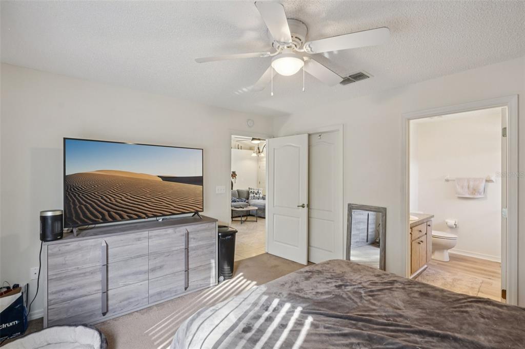 8340 Nevada Street Spring Hill, FL 34606 - Photo 12 of 23 a bedroom with a bed and a television