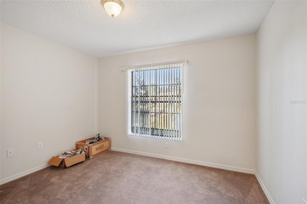 8340 Nevada Street Spring Hill, FL 34606 - Photo 17 of 23 an empty room with windows