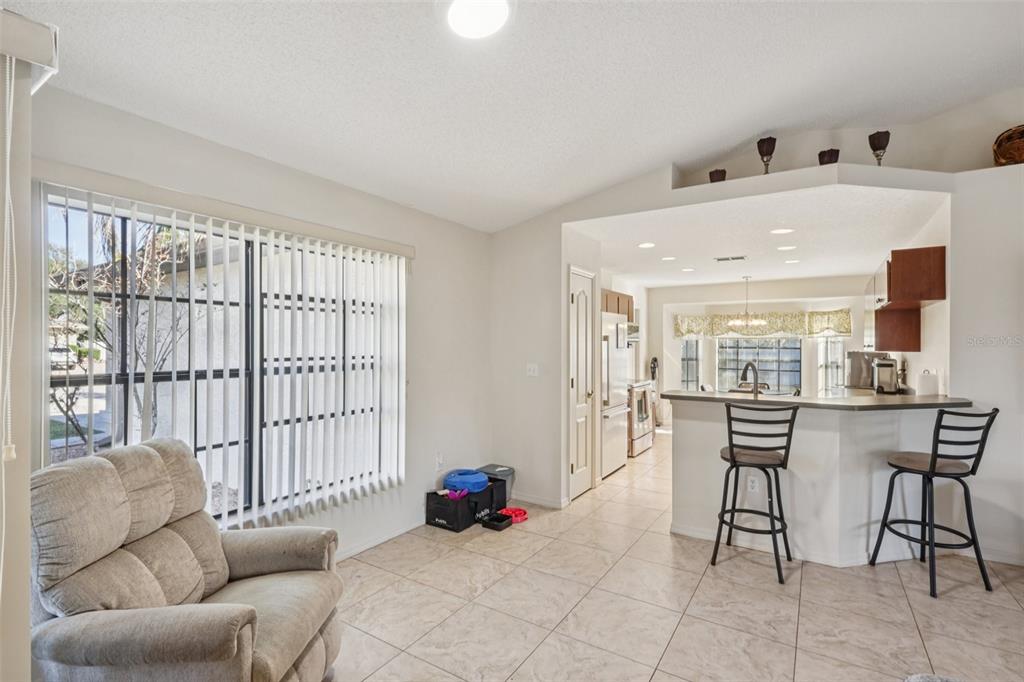8340 Nevada Street Spring Hill, FL 34606 - Photo 3 of 23 a living room with furniture and a large window