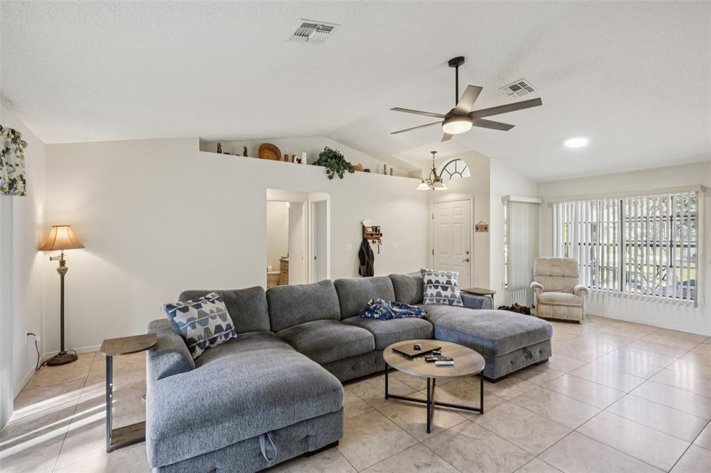 8340 Nevada Street Spring Hill, FL 34606 - Photo 5 of 23 a living room with furniture