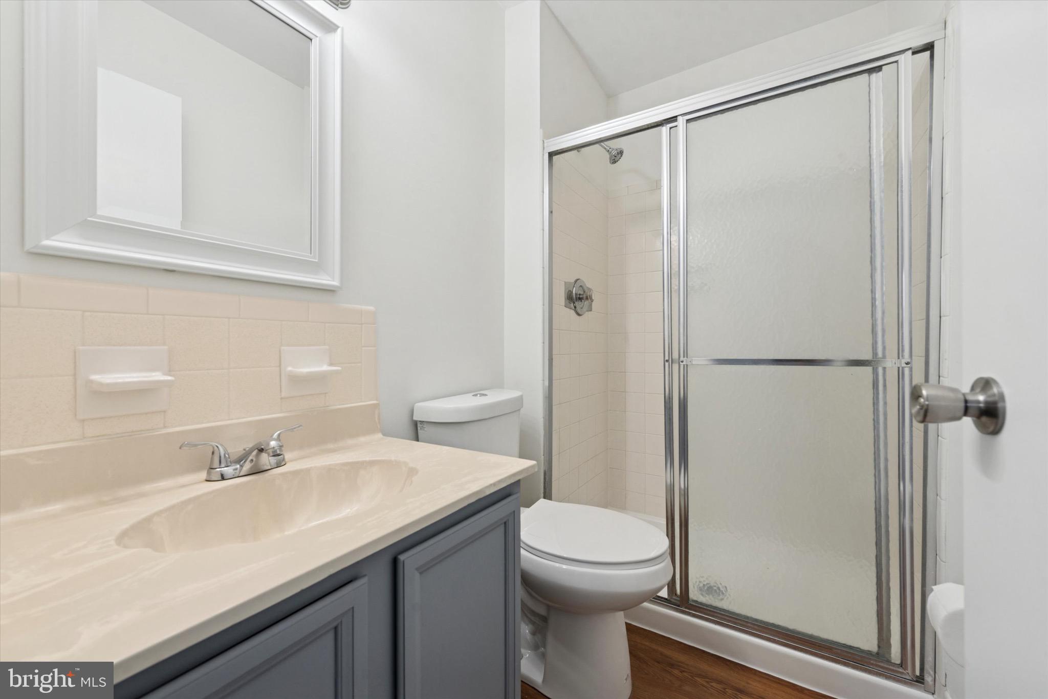 21 Markel Road Malvern, PA 19355 - Photo 14 of 23 a bathroom with a sink a toilet and shower