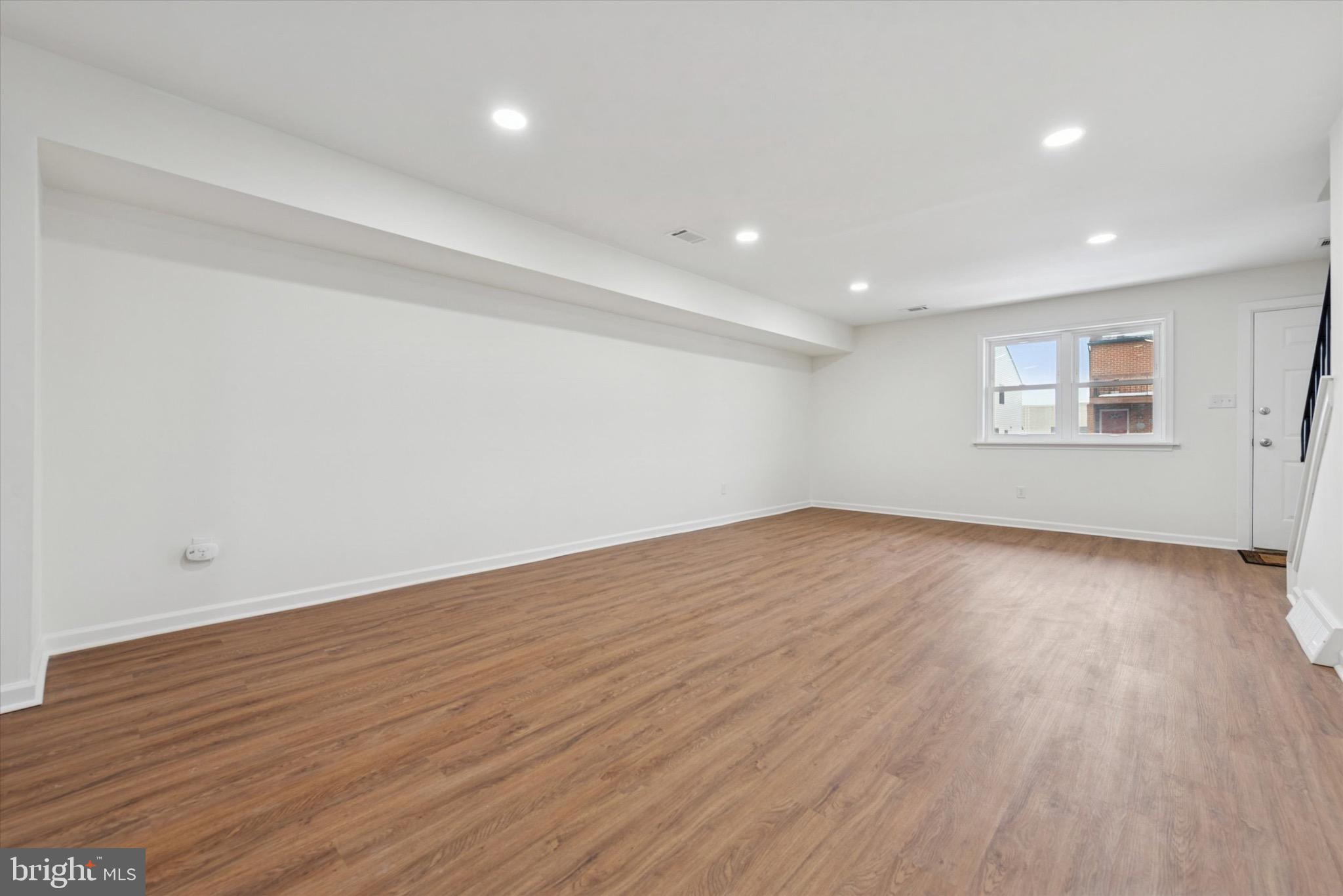 21 Markel Road Malvern, PA 19355 - Photo 4 of 23 an empty room with wooden floor and windows