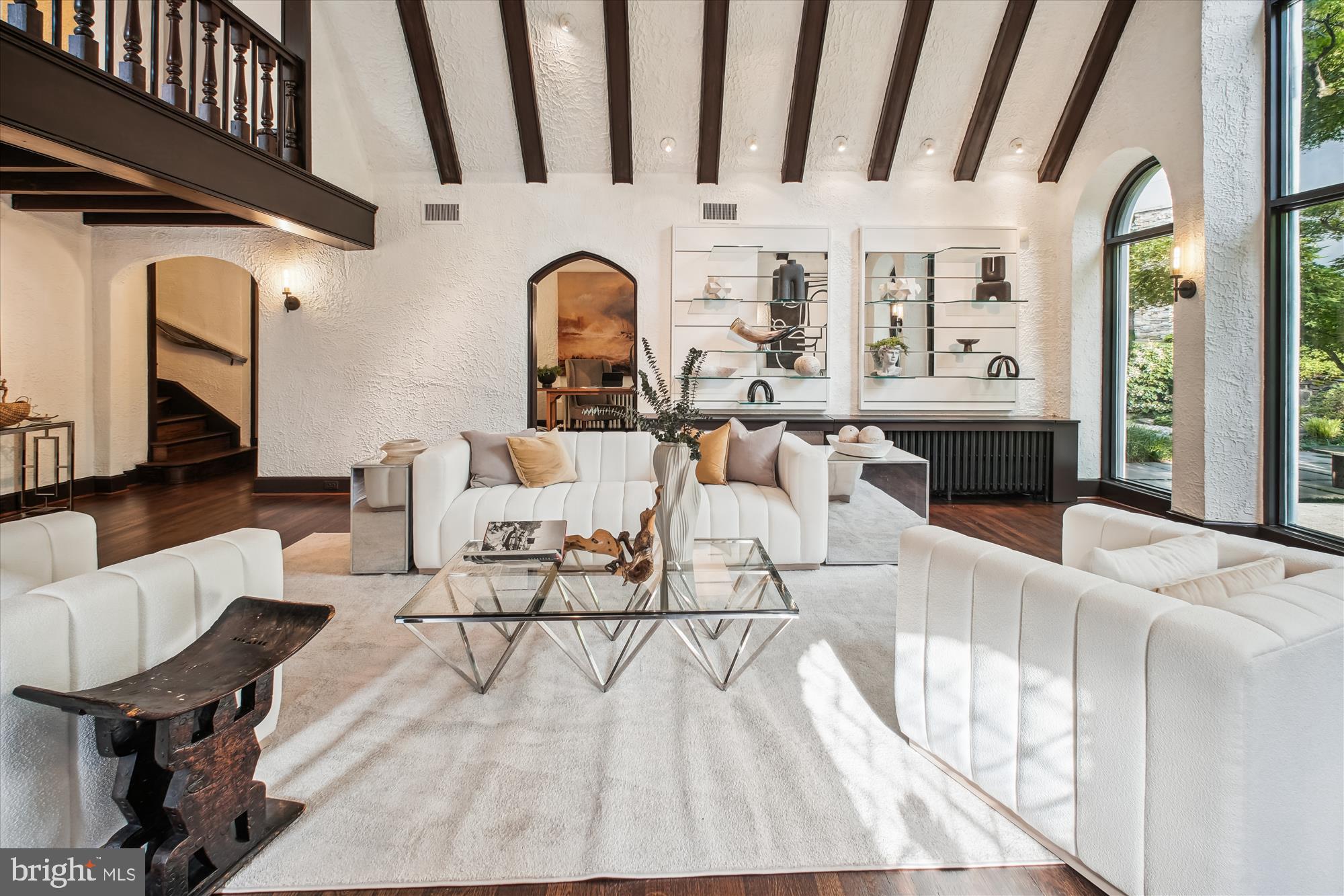 302 Ellsworth Drive Silver Spring, MD 20910 - Photo 14 of 64 a living room with furniture a fireplace and a table