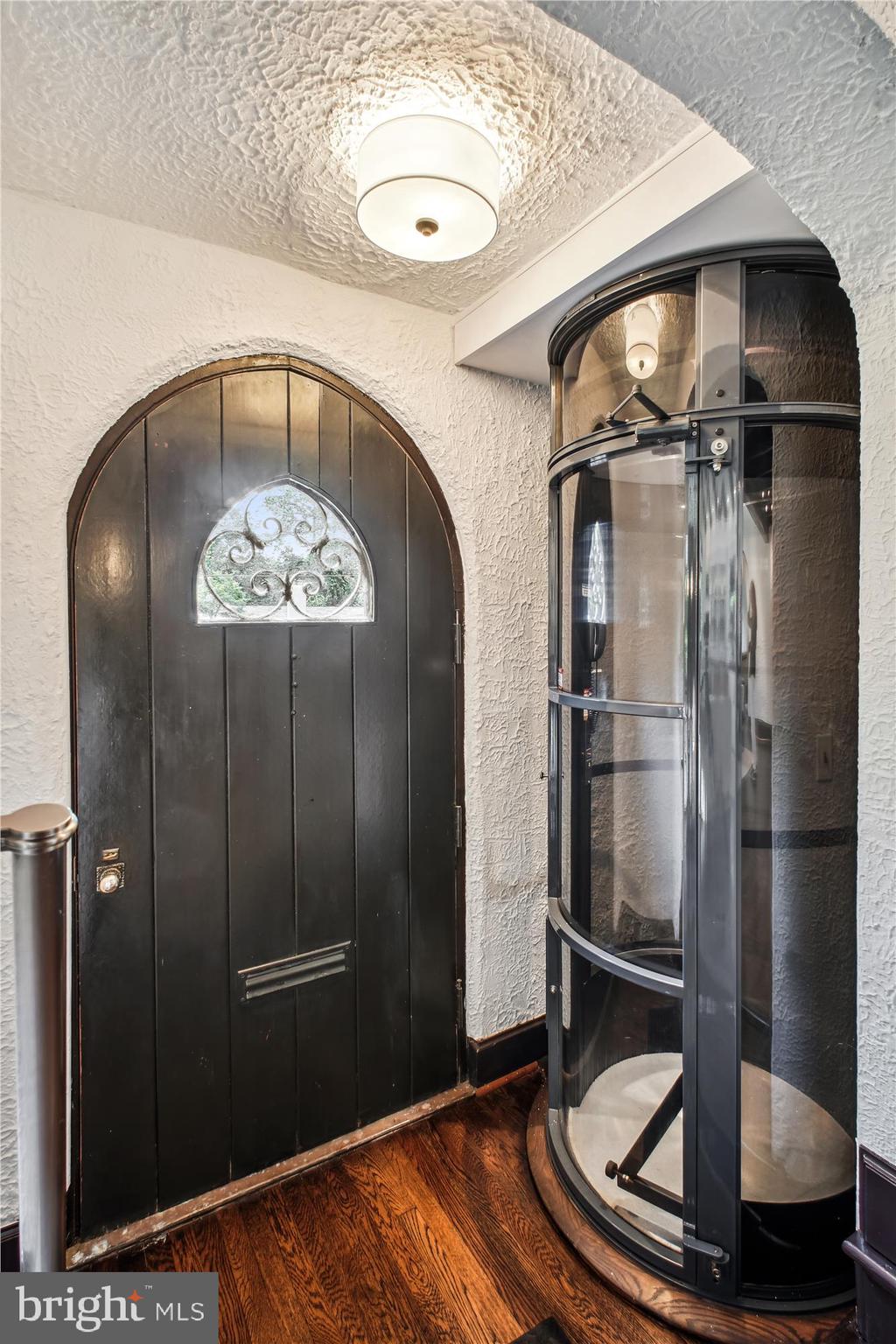 302 Ellsworth Drive Silver Spring, MD 20910 - Photo 17 of 64 Glass elevator from garage level