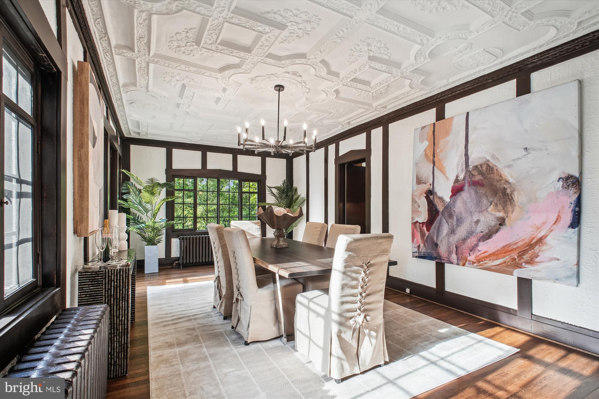 302 Ellsworth Drive Silver Spring, MD 20910 - Photo 19 of 64 a view of a dining room with furniture wooden floor and a chandelier