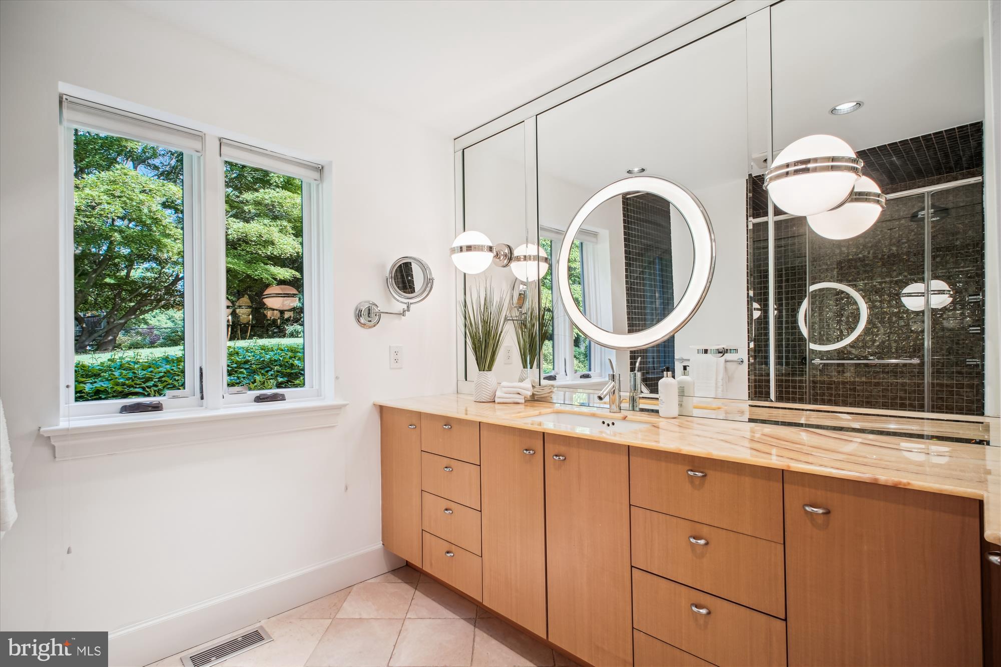 302 Ellsworth Drive Silver Spring, MD 20910 - Photo 29 of 64 a bathroom with a double vanity sink mirror and window
