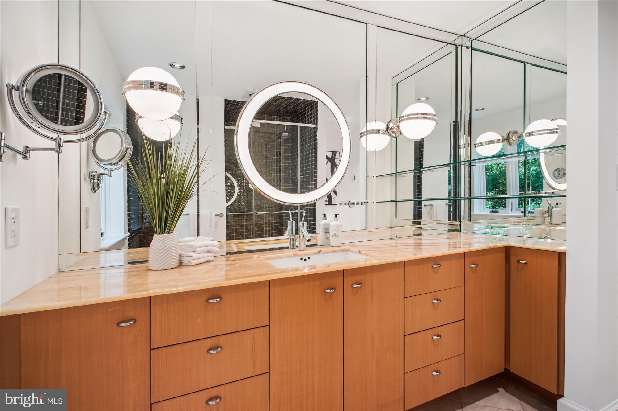 302 Ellsworth Drive Silver Spring, MD 20910 - Photo 30 of 64 a bathroom with a double vanity sink and a mirror