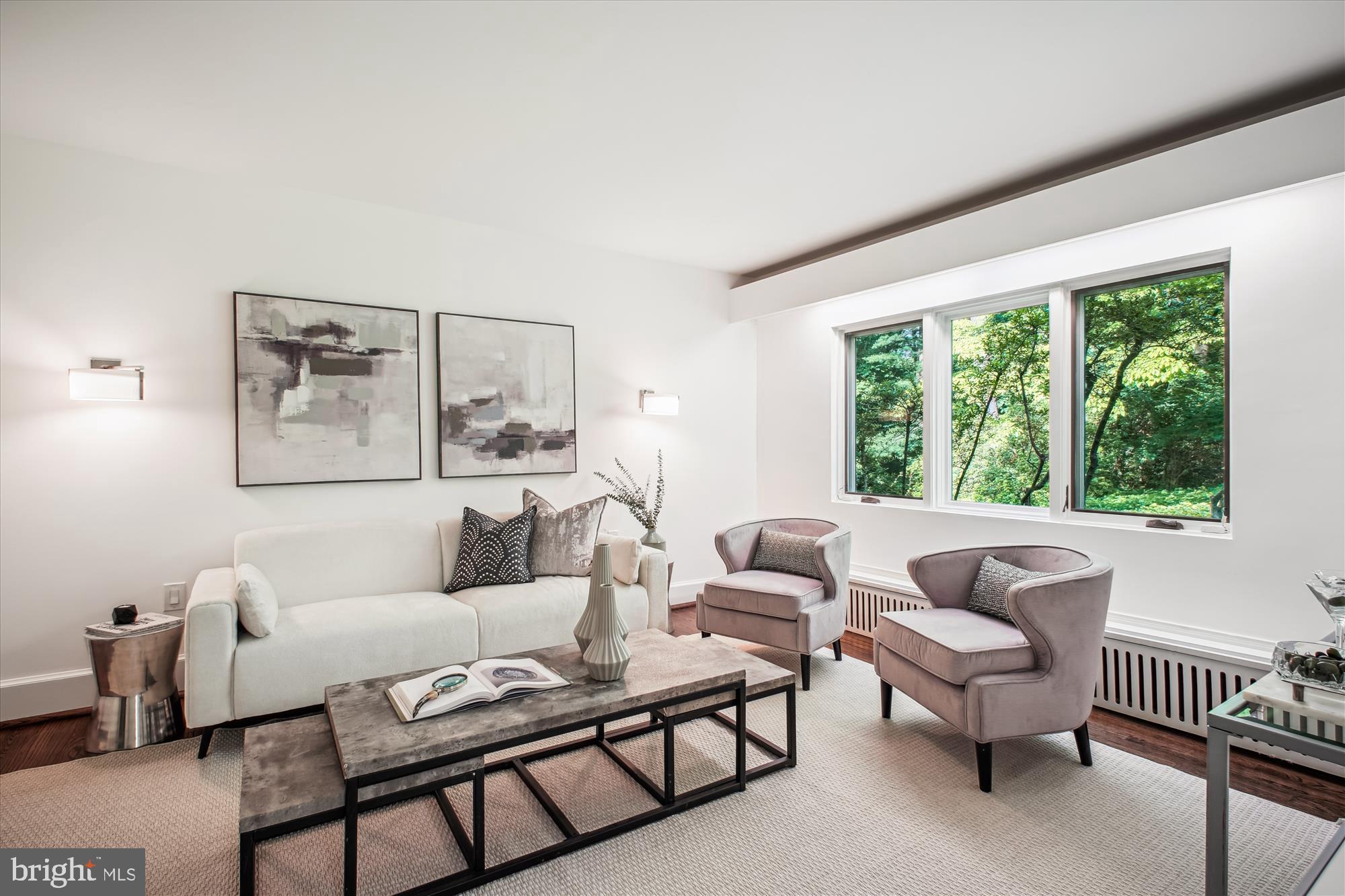 302 Ellsworth Drive Silver Spring, MD 20910 - Photo 34 of 64 a living room with furniture and a large window