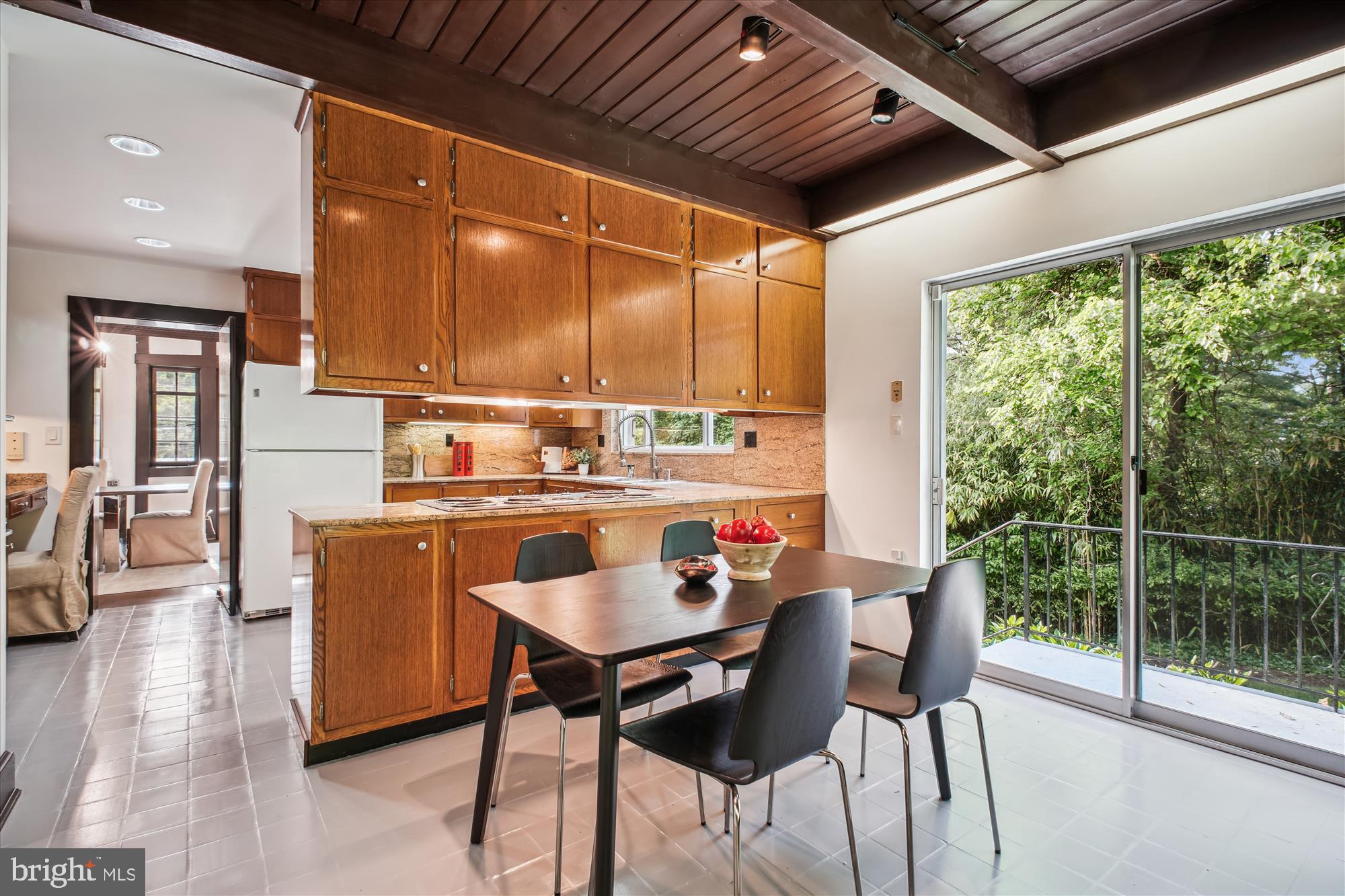 302 Ellsworth Drive Silver Spring, MD 20910 - Photo 36 of 64 a dining room with stainless steel appliances granite countertop a couch and chairs