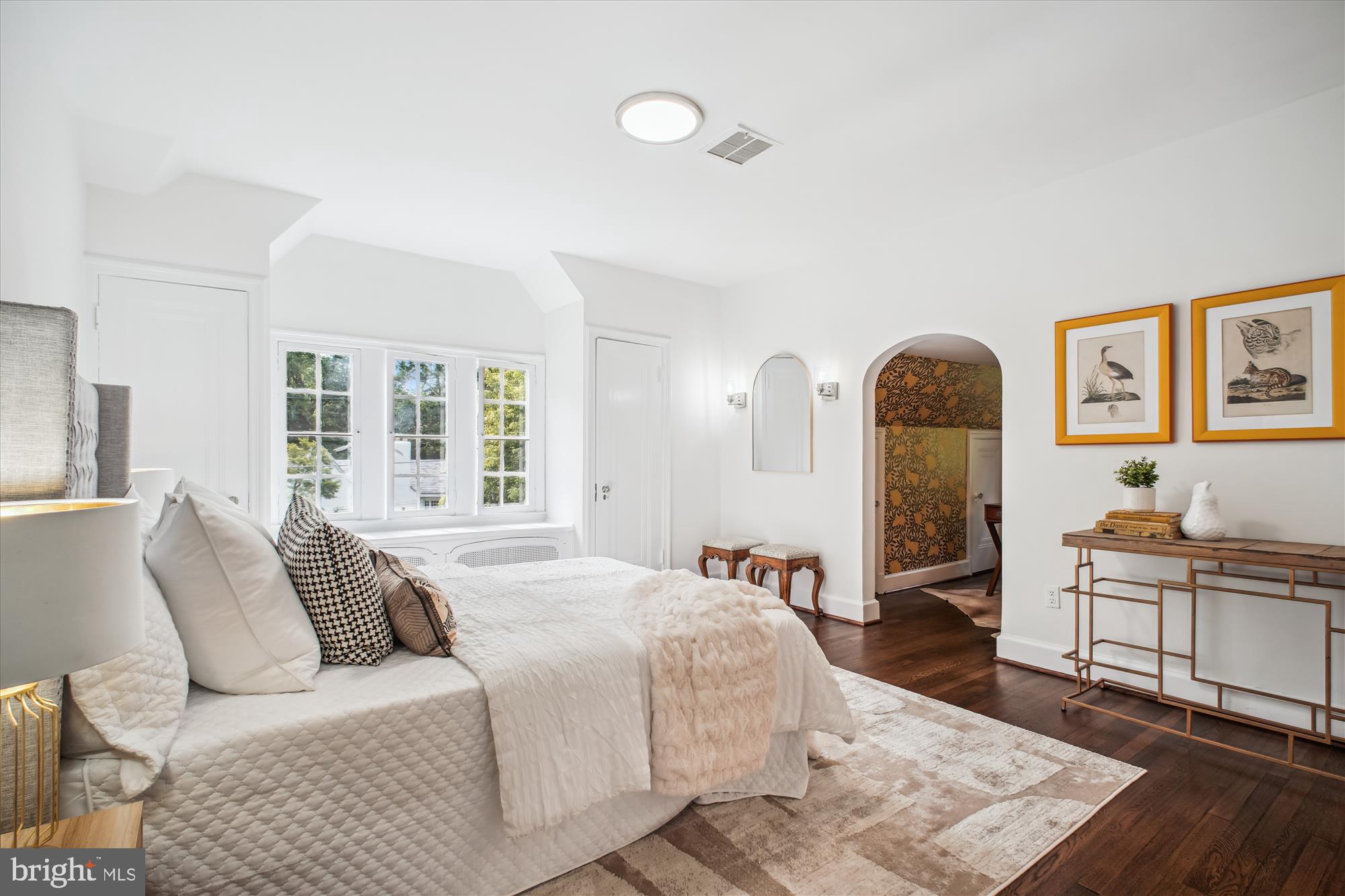 302 Ellsworth Drive Silver Spring, MD 20910 - Photo 46 of 64 a bedroom with a bed and wooden floor