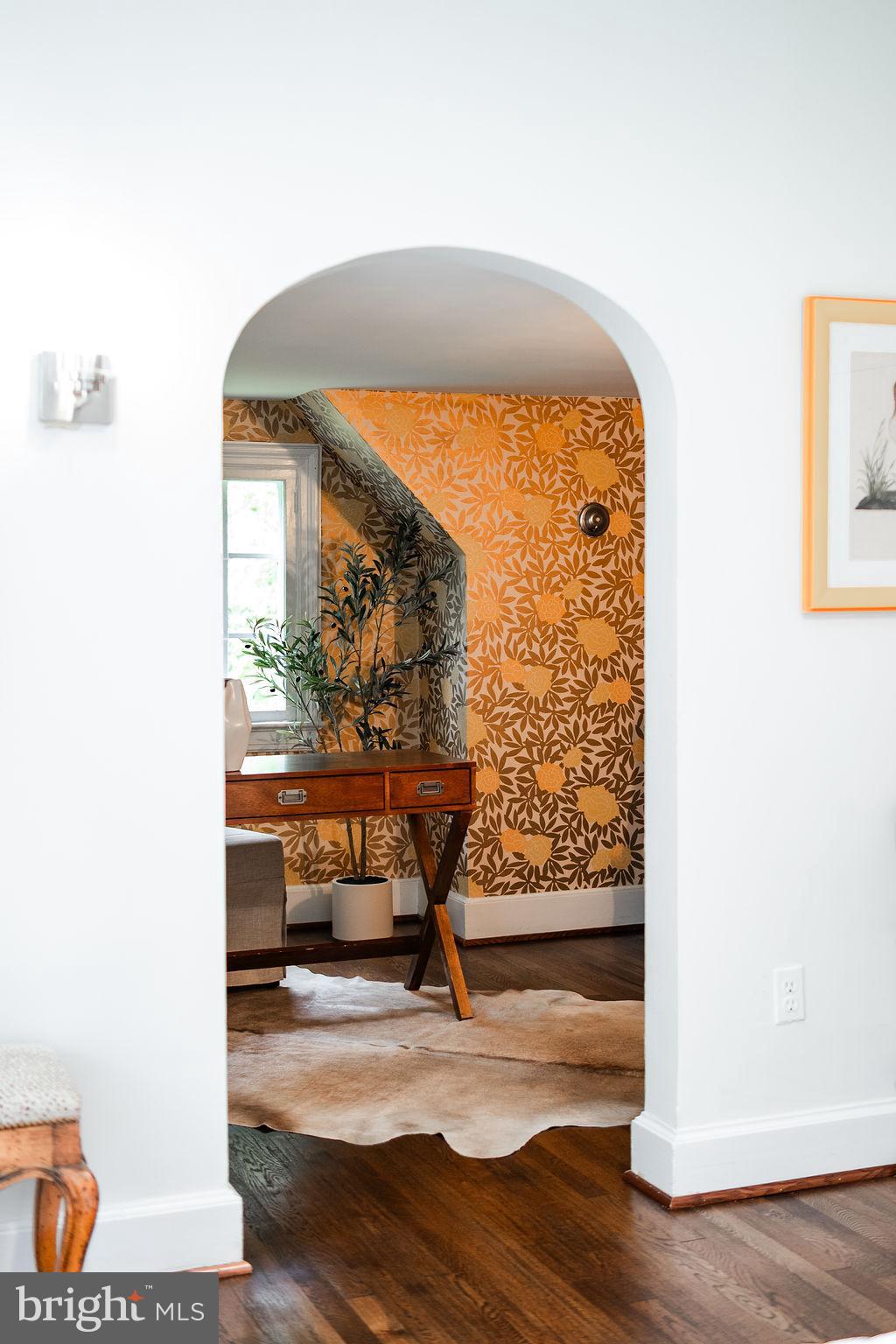 302 Ellsworth Drive Silver Spring, MD 20910 - Photo 48 of 64 a room with painting on the wall and a potted plant