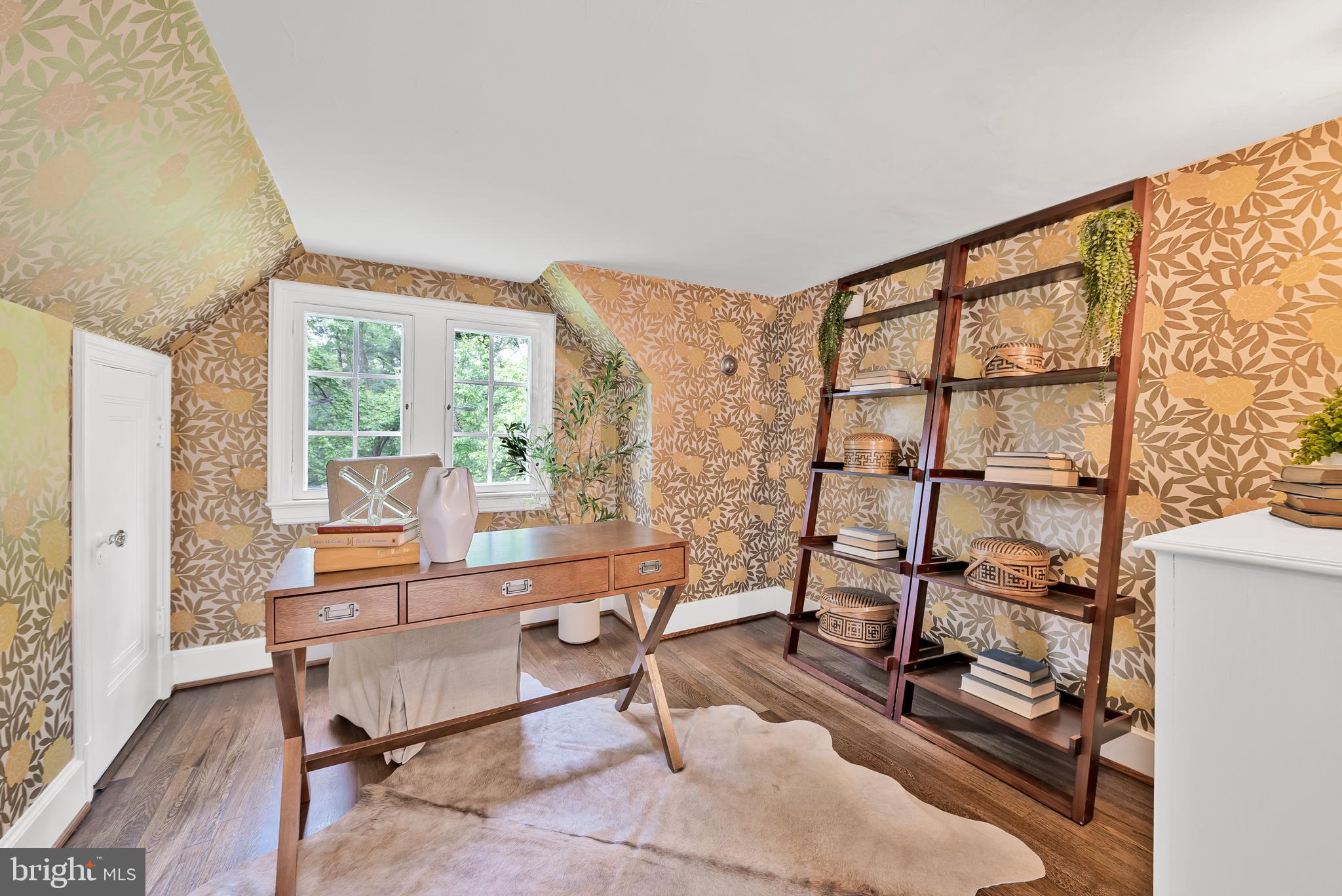 302 Ellsworth Drive Silver Spring, MD 20910 - Photo 49 of 64 a living room with furniture a flat screen tv and a floor to ceiling window