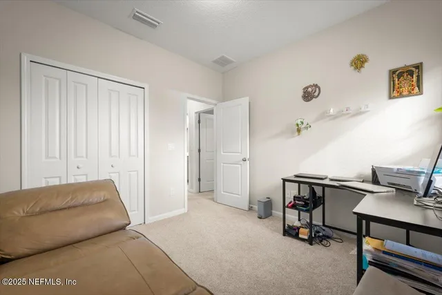 a spacious bathroom with a tub sink and mirror