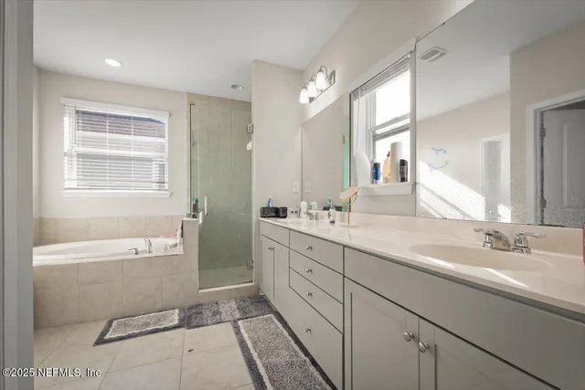 a white bath tub sitting next to a white sink