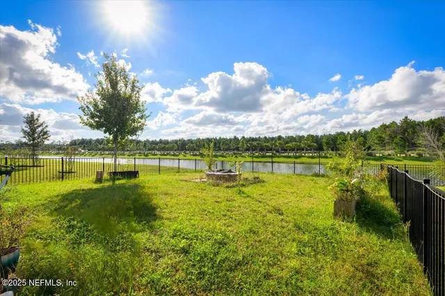 a view of a lake with houses in the back