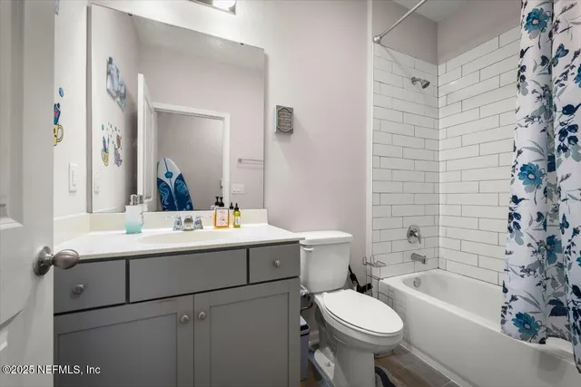 a room with furniture a air conditioner vent and a window