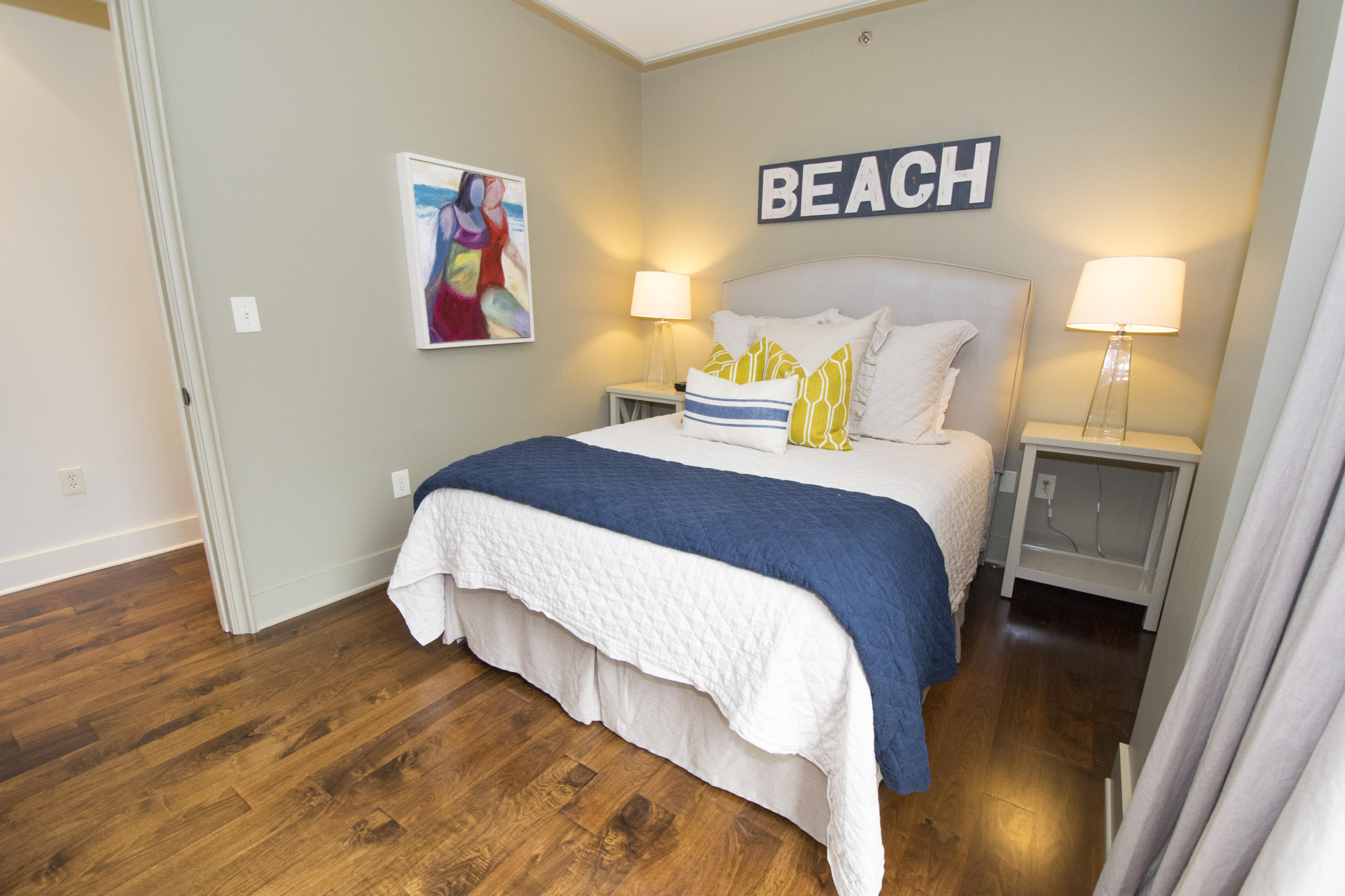 78 North Barrett Square, Unit 2 Rosemary Beach, FL 32461 - Photo 11 of 27 a bedroom with a bed and wooden floor
