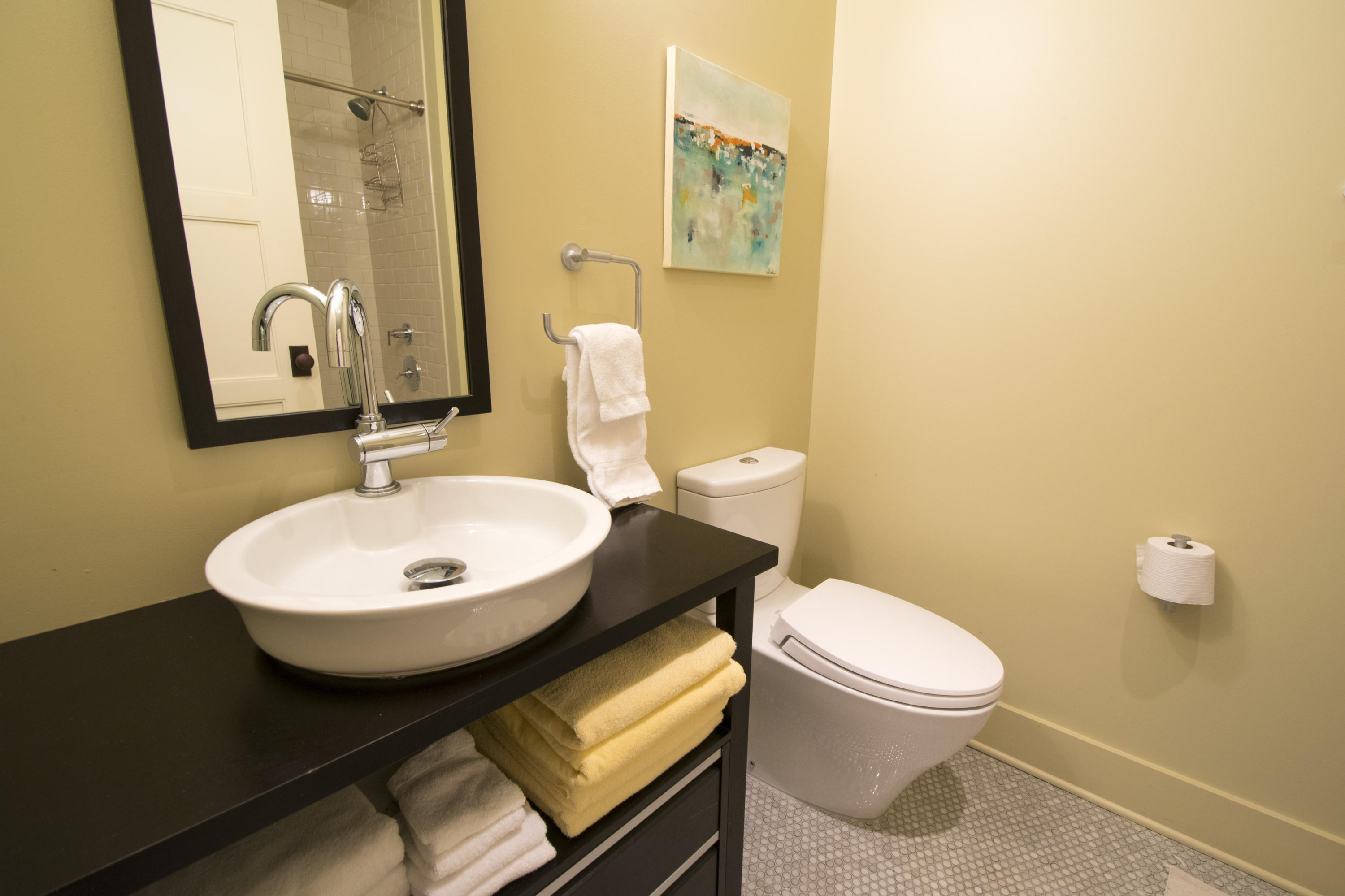 78 North Barrett Square, Unit 2 Rosemary Beach, FL 32461 - Photo 13 of 27 a bathroom with a toilet a sink and mirror