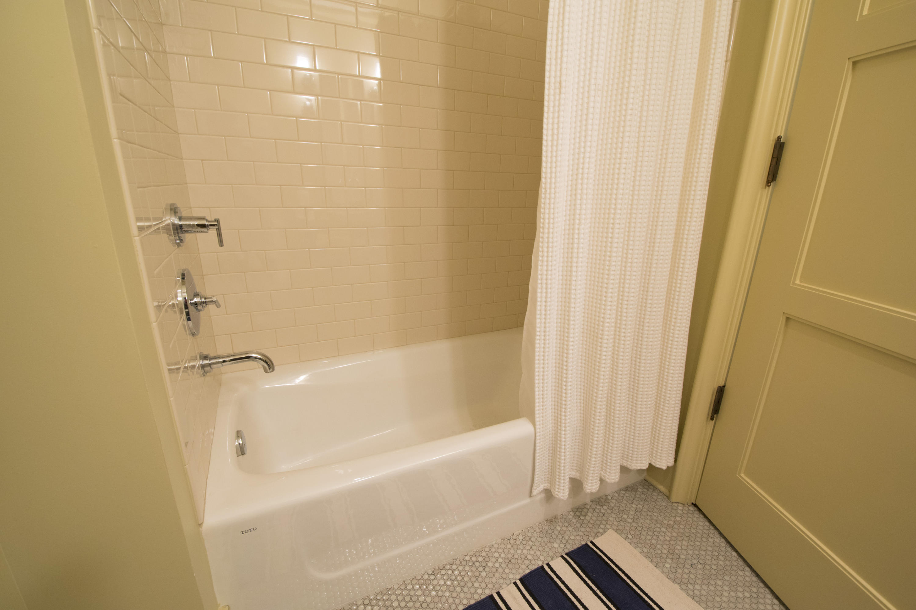 78 North Barrett Square, Unit 2 Rosemary Beach, FL 32461 - Photo 14 of 27 a bathroom with a bathtub