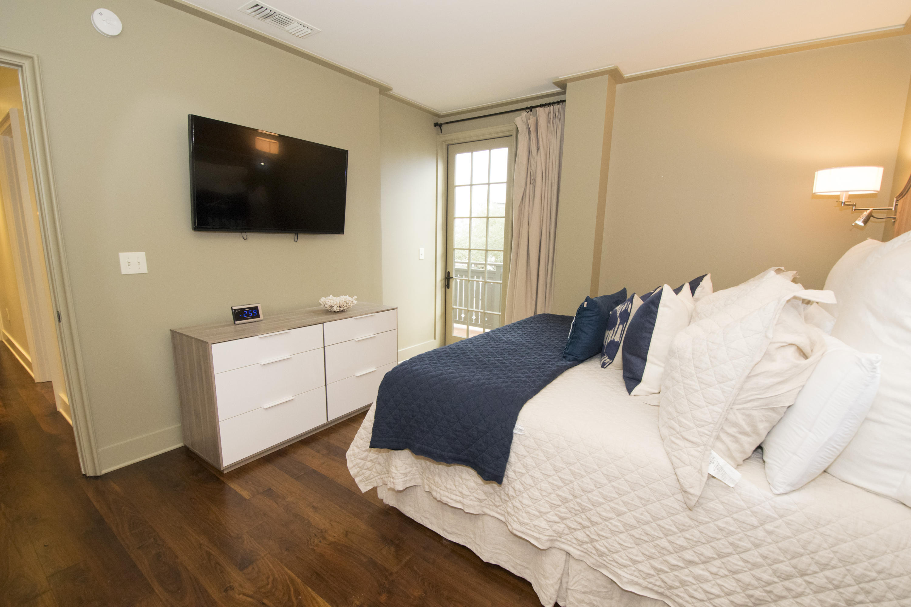 78 North Barrett Square, Unit 2 Rosemary Beach, FL 32461 - Photo 17 of 27 a bedroom with a bed tv and a window