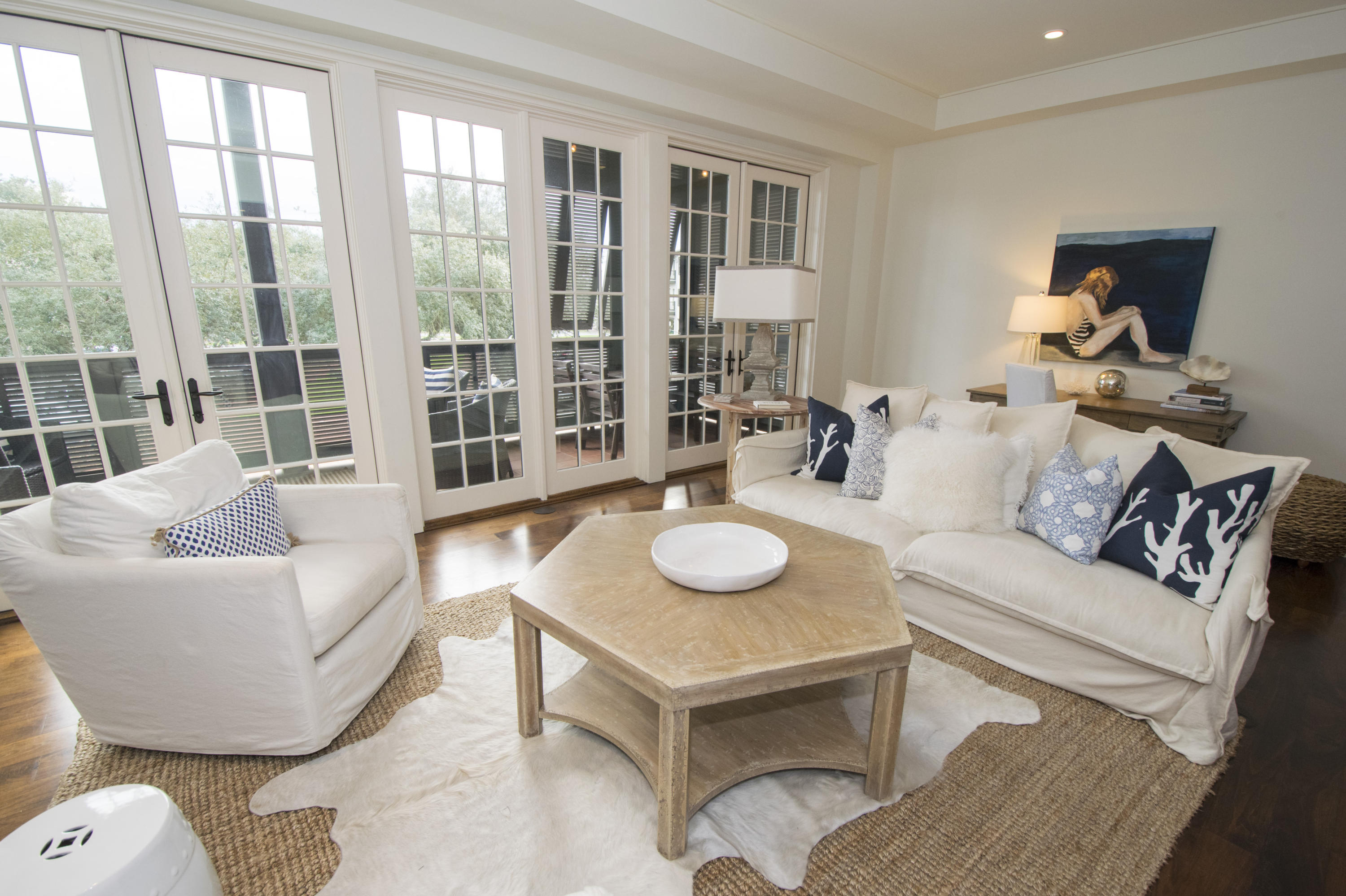 78 North Barrett Square, Unit 2 Rosemary Beach, FL 32461 - Photo 2 of 27 a living room with furniture and a table