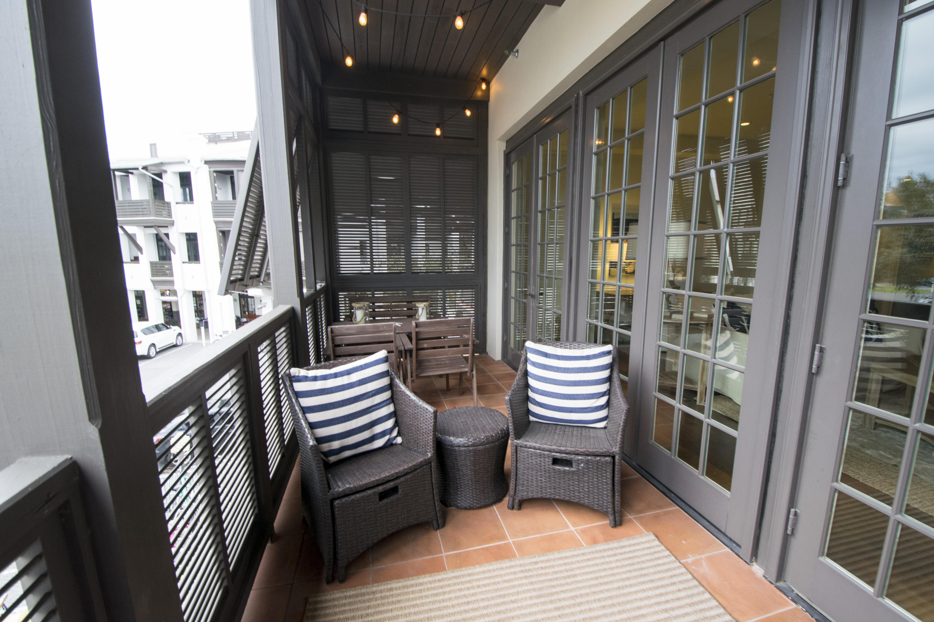 78 North Barrett Square, Unit 2 Rosemary Beach, FL 32461 - Photo 21 of 27 a view of a balcony with chairs