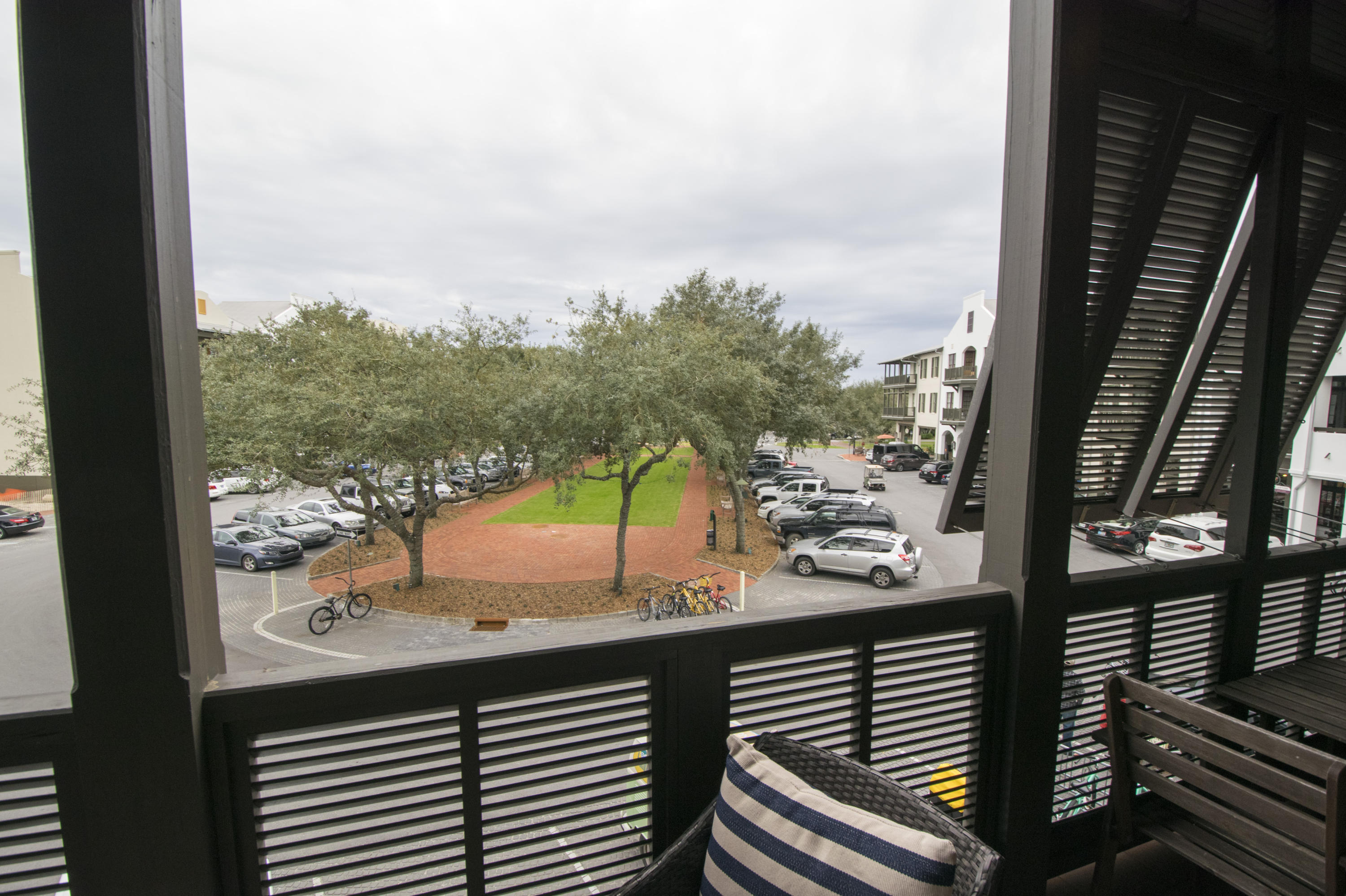 78 North Barrett Square, Unit 2 Rosemary Beach, FL 32461 - Photo 22 of 27 a view of a balcony with floor to ceiling windows wooden floor