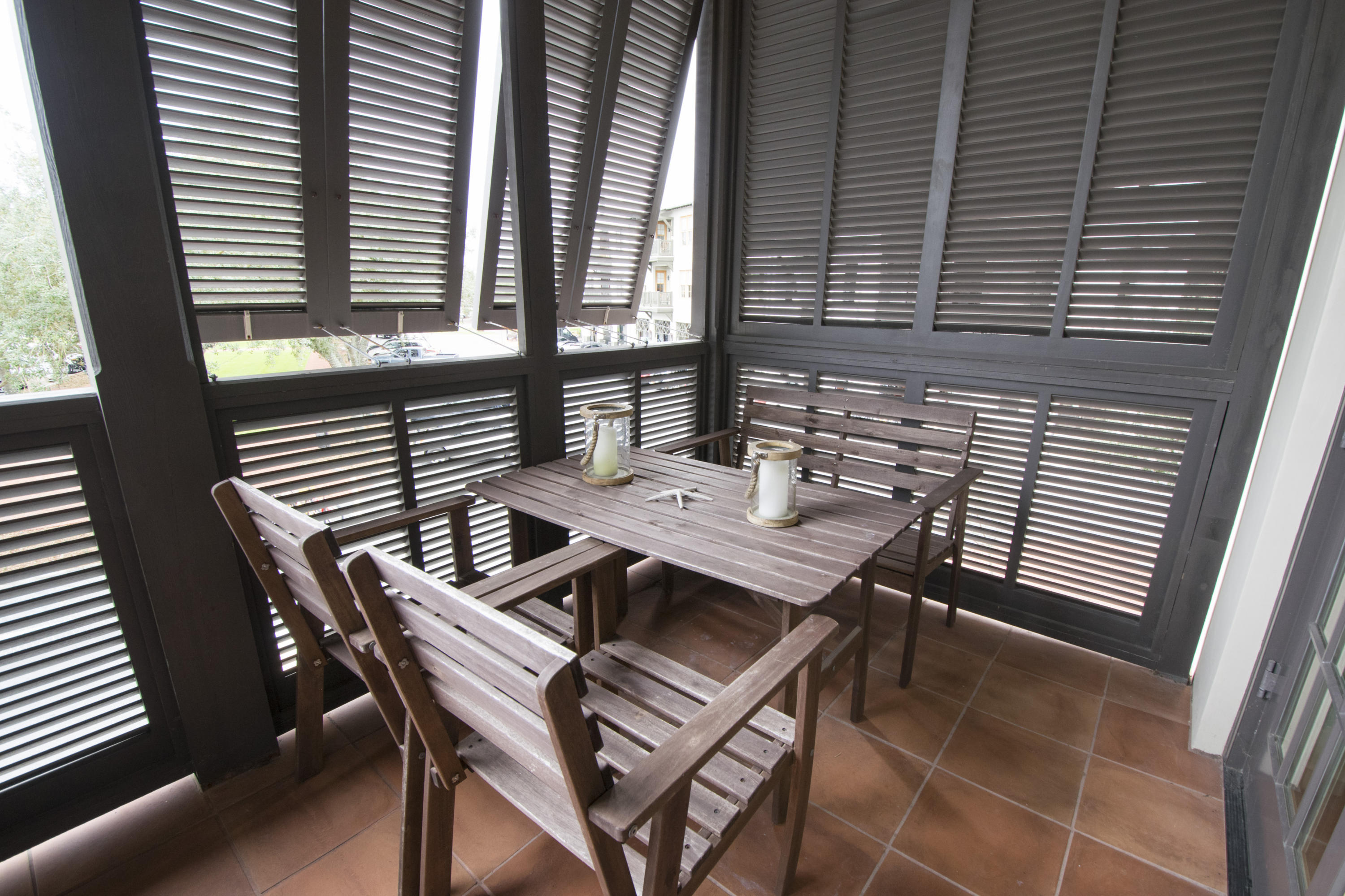 78 North Barrett Square, Unit 2 Rosemary Beach, FL 32461 - Photo 24 of 27 a view of a patio with a table and chairs