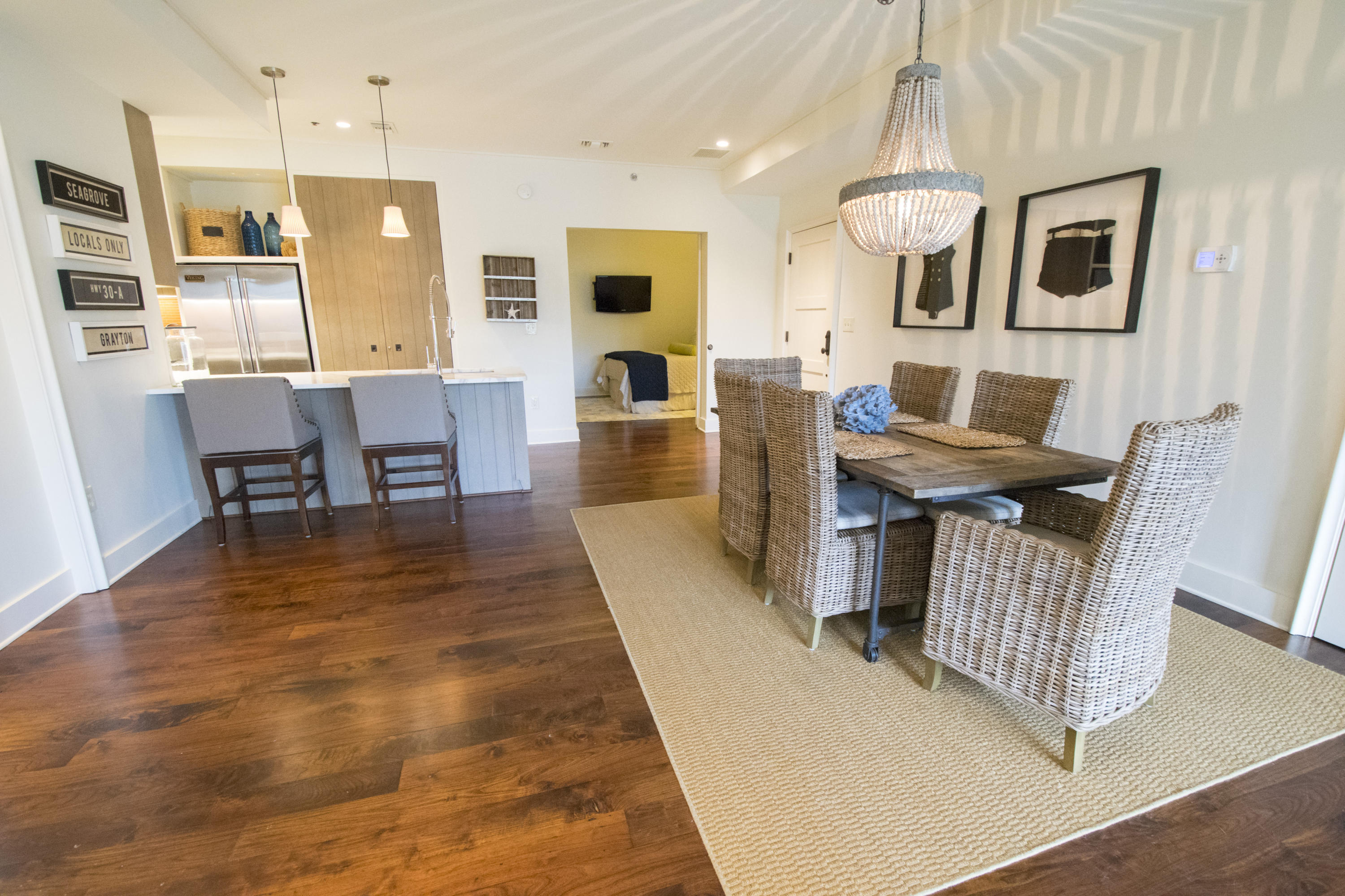 78 North Barrett Square, Unit 2 Rosemary Beach, FL 32461 - Photo 5 of 27 a living room with furniture kitchen view and a wooden floor