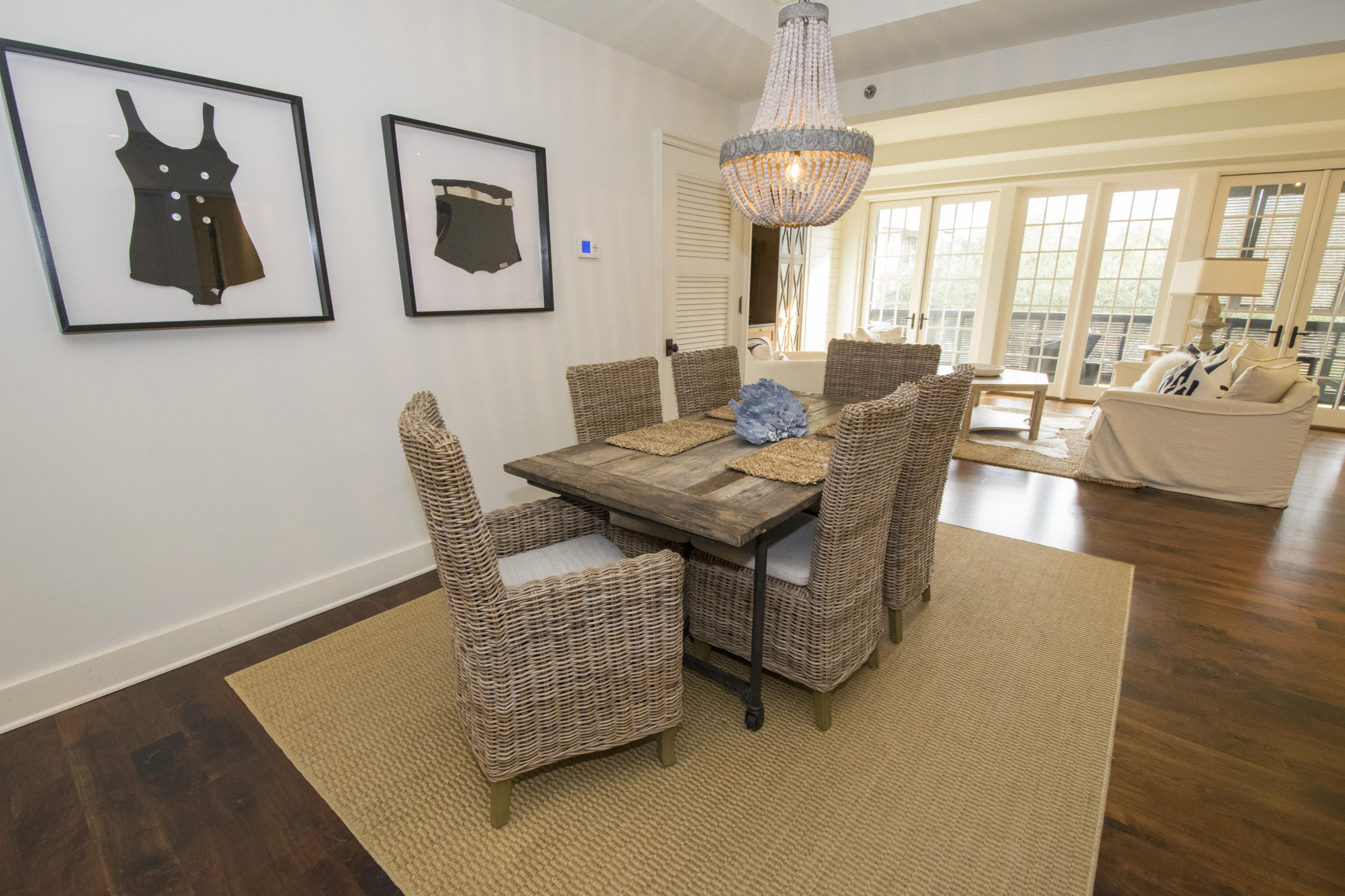 78 North Barrett Square, Unit 2 Rosemary Beach, FL 32461 - Photo 6 of 27 a dining room with furniture and wooden floor