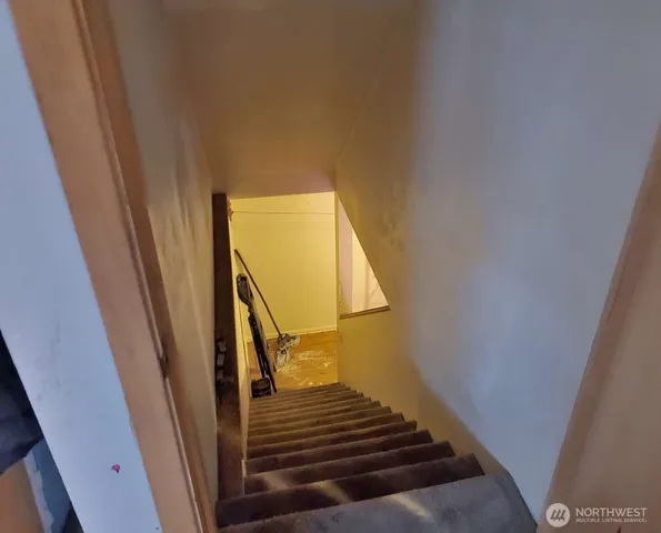 a living room with lots of furniture and a wooden floor