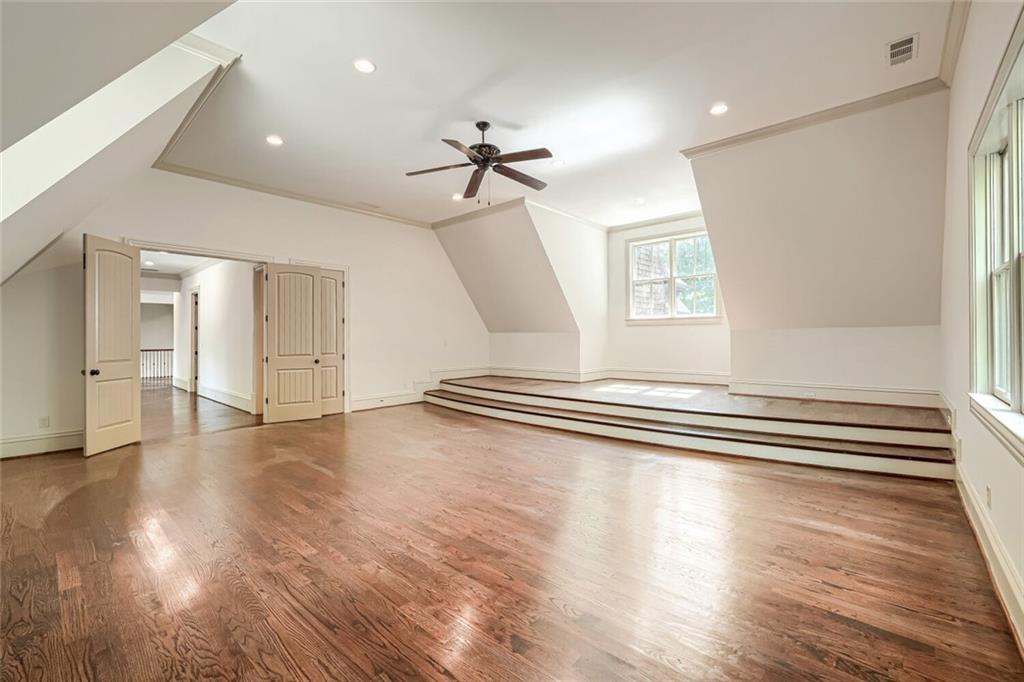 7965 Robin Road Cumming, GA 30041 - Photo 28 of 64 a view of empty room with wooden floor and fan