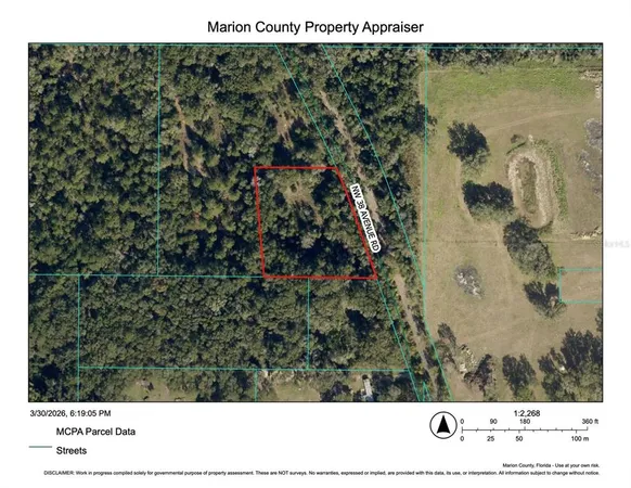 a view of a lake with a yard