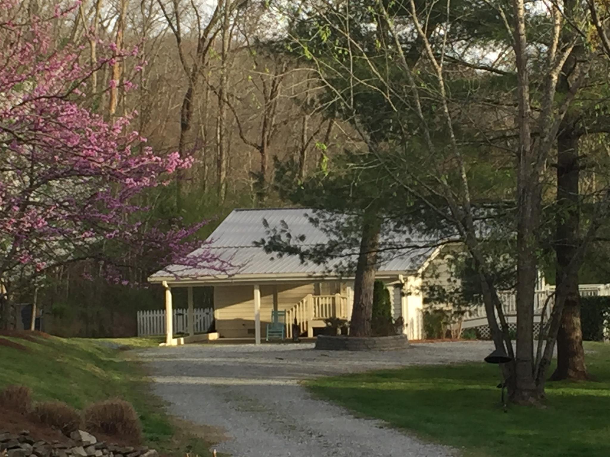9370 Hester Beasley Road Nashville, TN 37221 - Photo 1 of 22 Tucked Among 29 Private Acres Along the Scenic South Harpeth River, This Charming Cottage Home Offers Views, Privacy, and a Peaceful Retreat.